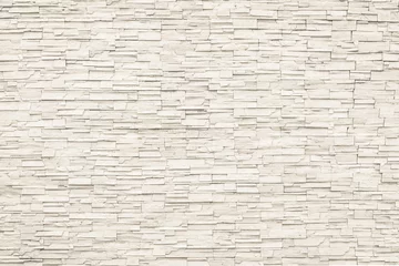 Wall murals Stones Rock stone brick tile wall aged texture detailed pattern background in cream beige brown color
