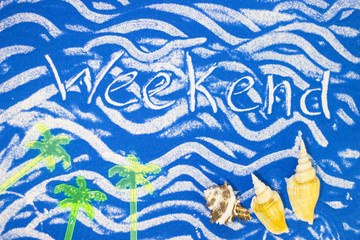 Weekend inscription on a blue colored sand with waves, sea shells, top view, flat lay