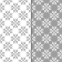 White and gray floral ornaments. Set of seamless backgrounds