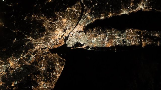 Group of city lights in the northeastern United States. New York City and Newark, New Jersey. Long Island. Aerial view. Elements of this image furnished by NASA.