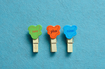 Two plus nine on a blue background