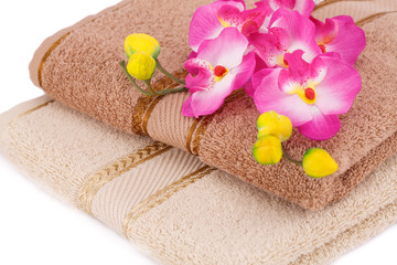 Fototapeta na wymiar Towels and flowers