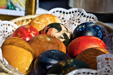 Brightly colored Easter eggs in a basket