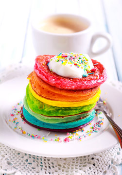 Rainbow pancakes, served in pile