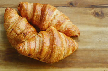 Corissants on wooden background