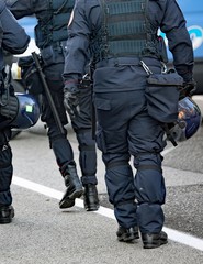 police in riot gear with protective helmet