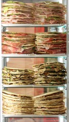 Refrigerator with lots of stuffed sandwiches called Piadina in Italian language