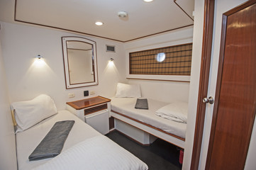 Fototapeta na wymiar Cabin in a luxury private motor yacht