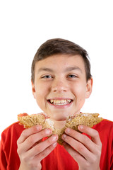 Young caucasian teenage boy with a sandwich