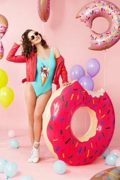Summer Fashion. Woman In Swimsuit With Balloons