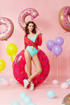 Summer Fashion. Woman In Swimsuit With Balloons