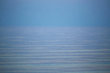 Obraz premium colorful sunset on a calm sea horizon