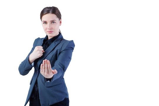Young caucasian business woman in full length, ready for a fight isolated on white background.