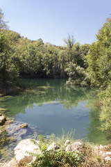 Fototapeta na wymiar The natural park surrounding Kravica waterfalls in Bosnia Herzegovina