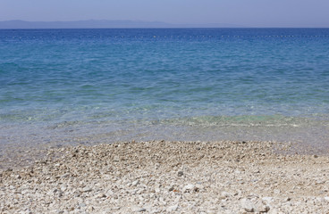 Stobrec beach with its white pebbles and crystalline beach