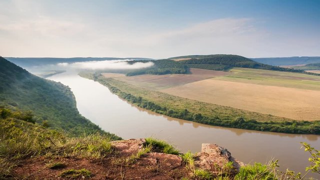 Vivid view of the sinuous river flowing through mountains. Location place Dnister canyon, Ukraine, Europe. Time lapse clip.