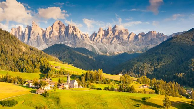 Sunny day in St. Magdalena village. Location famous place Funes valley, Dolomiti Alps. Time lapse clip.
