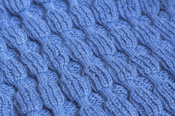 Blue Knitted Fabric Texture. Beautiful knitting wool background.