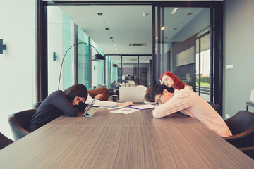 Group of business people sleeping in a meeting room, Multi ethnic