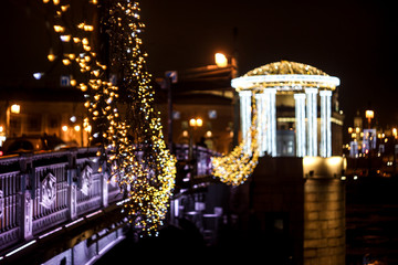 night city, illumination of the evening city, celebration on the bridge, garland on the bridge,...