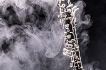 An oboe in smoke - obrazy, fototapety, plakaty