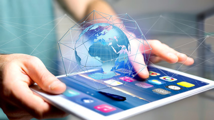 Businessman using smartphone with a Connected network over a earth globe concept on a futuristic interface - 3d rendering