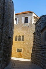 Narrow streets of Jerusalem Old City. Stone brick texture.
