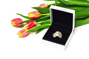 Car as gift for woman, concept. Miniature car in open gift box, tulips