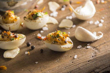 deviled quail eggs arranged nicely on wooden table with decoration