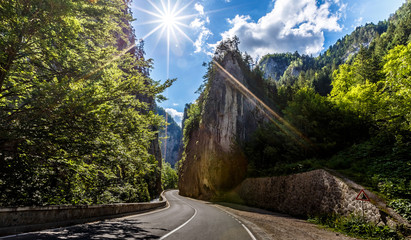 majestic mountain scenery. road in mountains, glowing in sunlight. Romania- Carpathian Mountains. Bicaz Canyon Cheile Bicazului . Beauty in the world