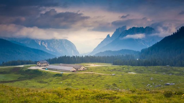 Fantastic misty view on the peak Cresta di Enghe. Location place Sauris di Sotto, Dolomiti Alps. Italy, Europe. Time lapse clip, interval shooting video.