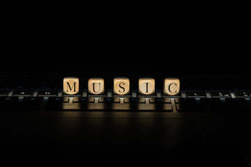 Music word on wooden cubes. Music concept © Casimiro