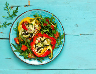 peppers stuffed with couscous salad with vegetables.