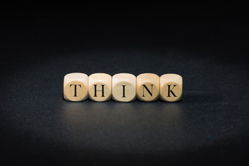 Think word on wooden cubes. Think concept