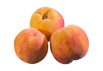 Three yellow peaches are isolated on white background