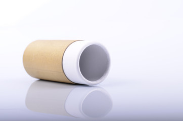 Recycled cylinder paper tube container on white background