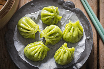 Steamed edamame dim sum. Sticky spinach & rice dumplings, filled with edamame, mint and water chestnuts 