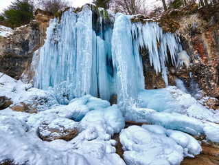 Frozen waterfall in the mountains