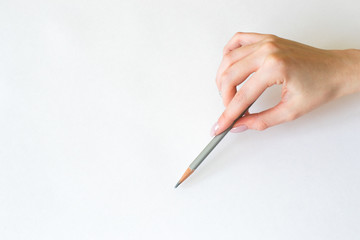 the hand with a pencil