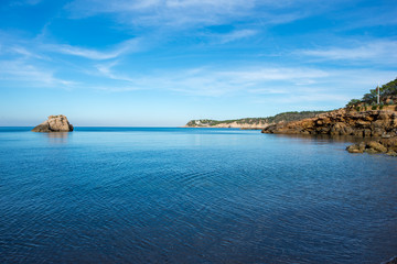 Naklejka premium The coast on a blue day in Ibiza