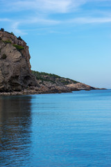 Fototapeta na wymiar The coast on a blue day in Ibiza