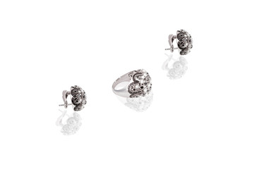 Platinum precious earrings ring female with diamonds  on white isolated background.