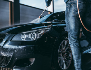 Car washing. Cleaning Car Using High Pressure Water. 