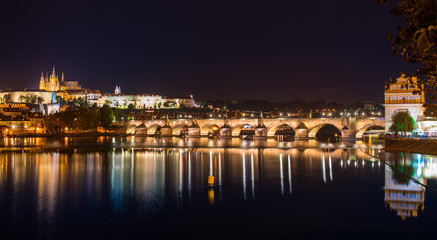 Fototapeta na wymiar A beautiful view on karlov bridge in the evening prague