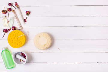 Skin care set on a white wooden background