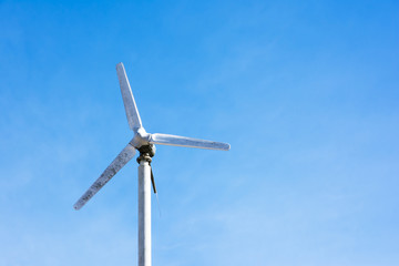 Electric turbine with blue sky background