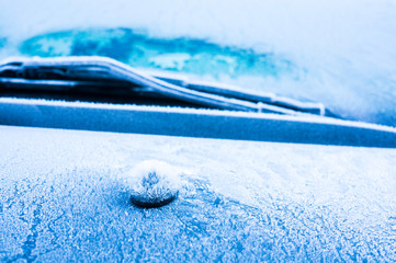 The ice-cold frost forms ice crystals in beautiful unique patterns on the Car