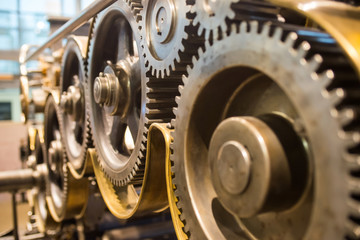 huge mechanical gears wheels at printery closeup view