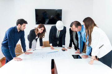 Team of architects presenting construction project. Engineers and Architects Planning for a New Project.