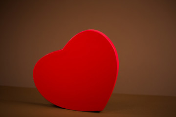 red heart on brown background